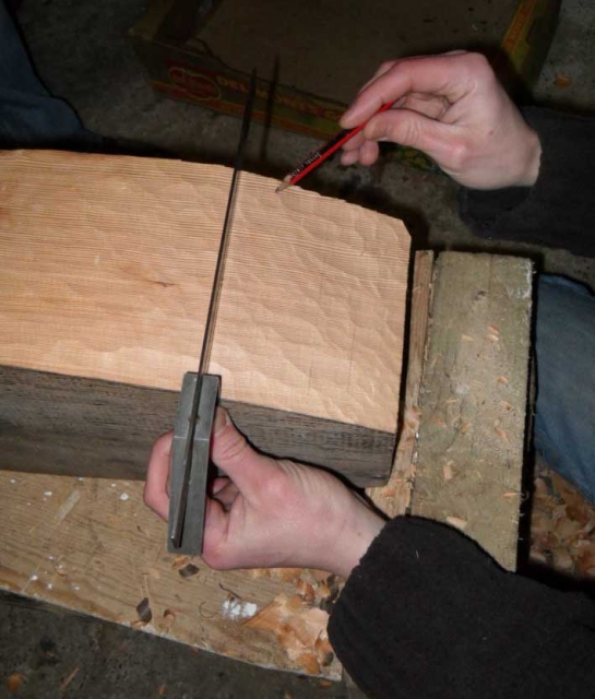 Brian checking the level of the chiselling. Photo: SR